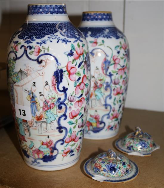 Pair of Chinese clobbered vases and covers (damaged)